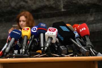 Press conference microphones set up for media coverage
